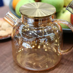 Wilmax Teekanne 1200 ml mit Federfilter und mit Edelstahldeckel Gold aus Thermoglas